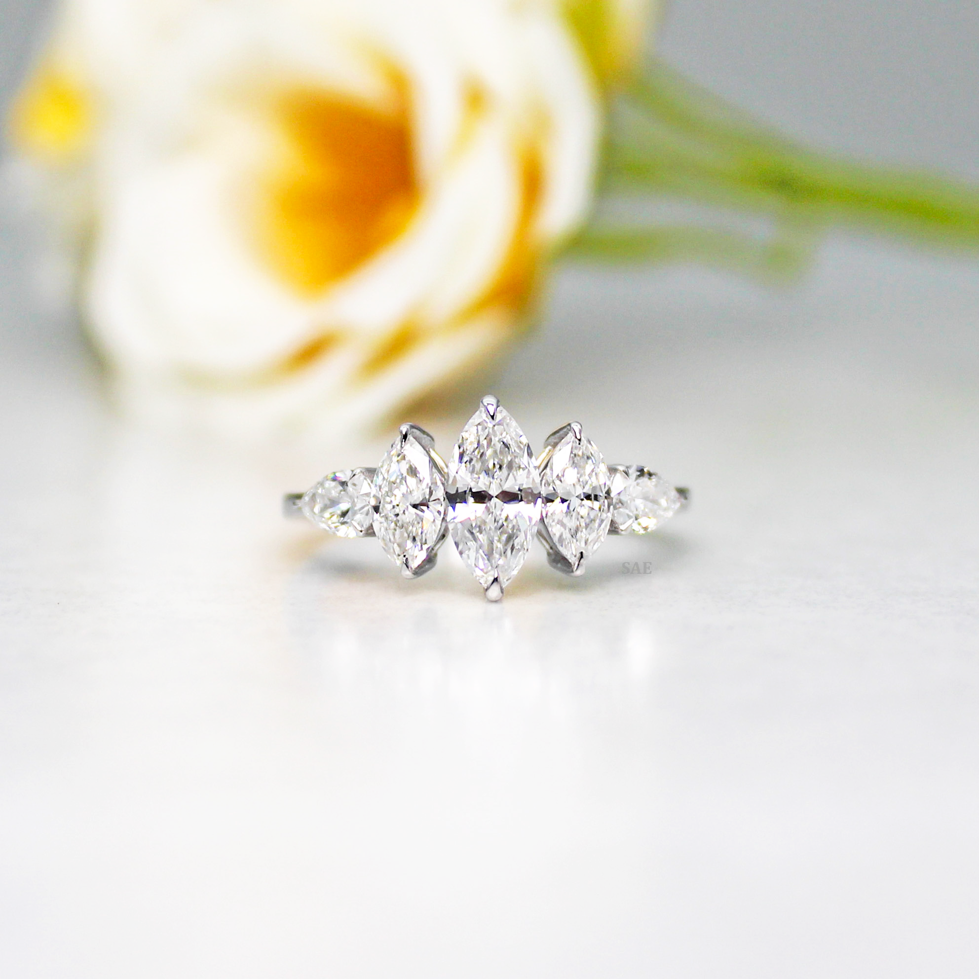 Marquise and side Pear Diamond Ring
Three Marquise with Pear shape Diamond Ring
Lab Grown Diamond Ring
Marquise Cut Engagement Ring
Fancy Shape Diamond Ring
Five Stone Ring
14k Gold Ring
Three step Marquise Ring
Gift for her
Diamond Jewelry
Bridal Ring
Engagement Ring
Wedding Ring