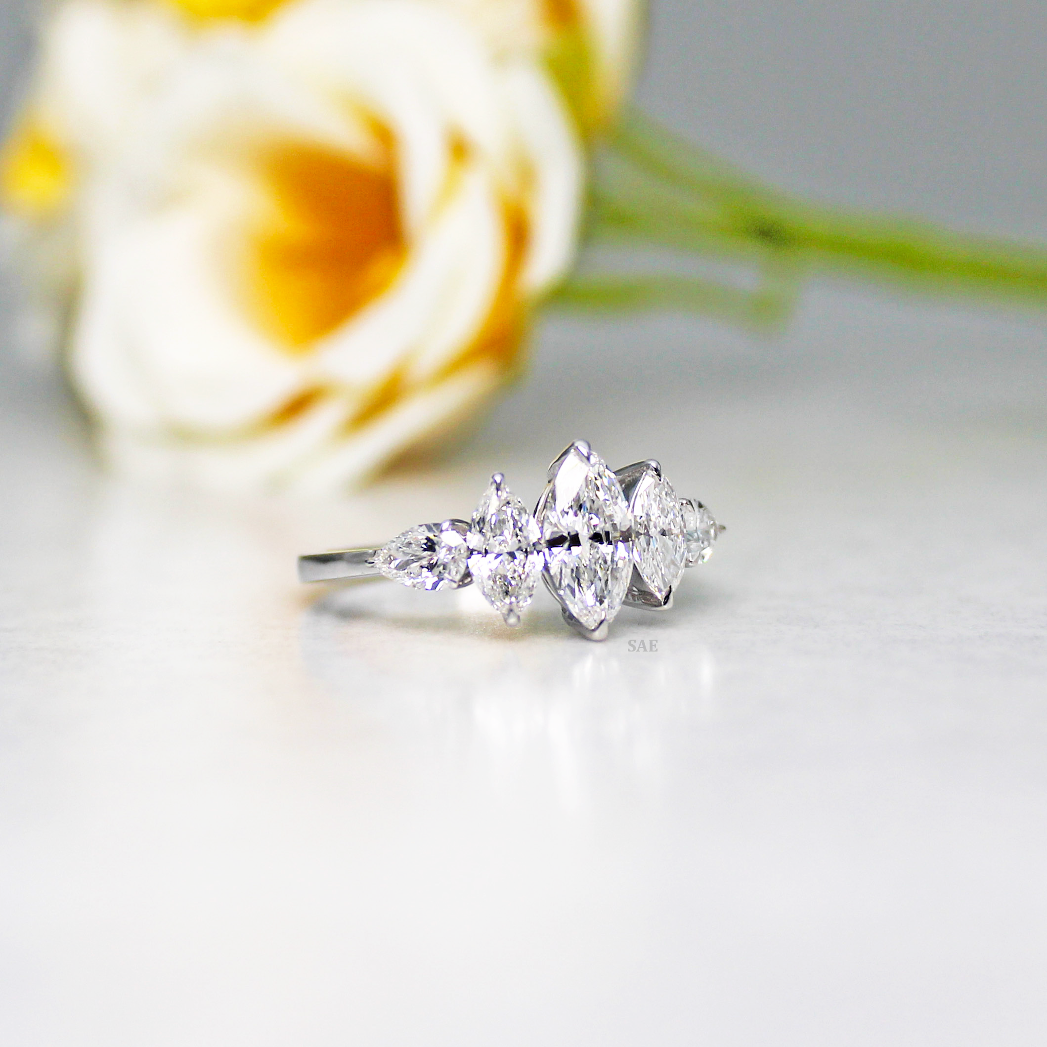 Marquise and side Pear Diamond Ring
Three Marquise with Pear shape Diamond Ring
Lab Grown Diamond Ring
Marquise Cut Engagement Ring
Fancy Shape Diamond Ring
Five Stone Ring
14k Gold Ring
Three step Marquise Ring
Gift for her
Diamond Jewelry
Bridal Ring
Engagement Ring
Wedding Ring